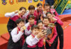 Japan's gold medal-winning BATC women's team take a selfie during the medal ceremony. (photo: AP)