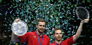 Vladimir Ivanov/Ivan Sozonov of Russia hold up the 2016 All England men's doubles champion trophy during the awarding ceremony.(photo: Reuters / Andrew Boyers)