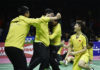 Chinese players storm the court after the Li Junhui/Liu Yuchen clinch the winning point for China. (photo: AP)